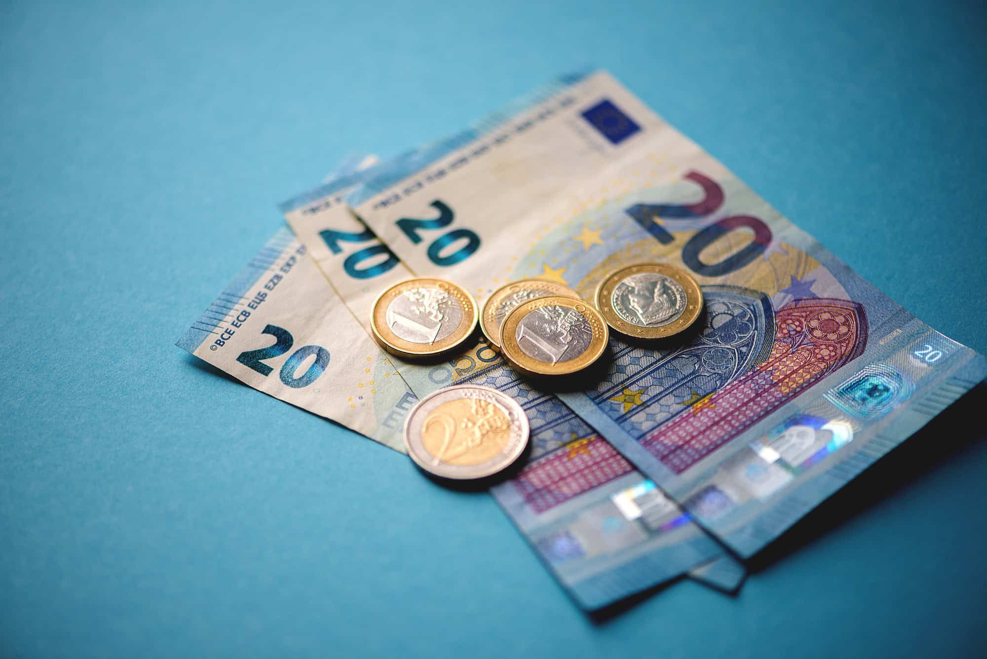 Cash money closeup on blue background